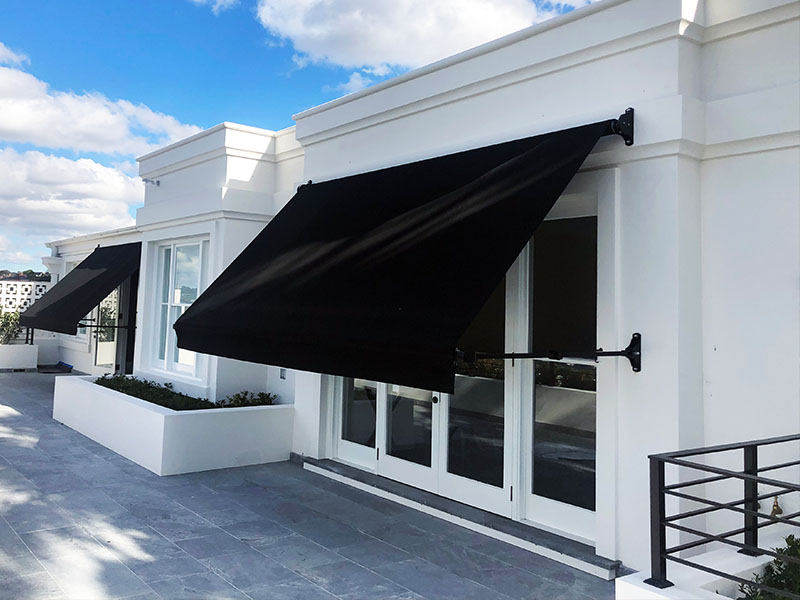 Federation style retractable drop arm awning for a stylish traditional look