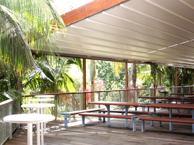 Retractable awning over deck for all weather protection