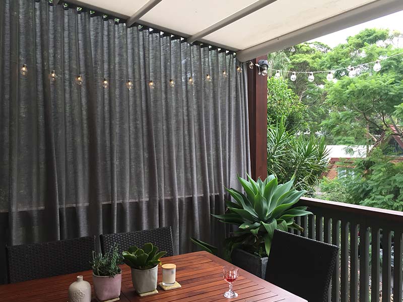 outdoor curtains with retractable roof for protection from sun and rain