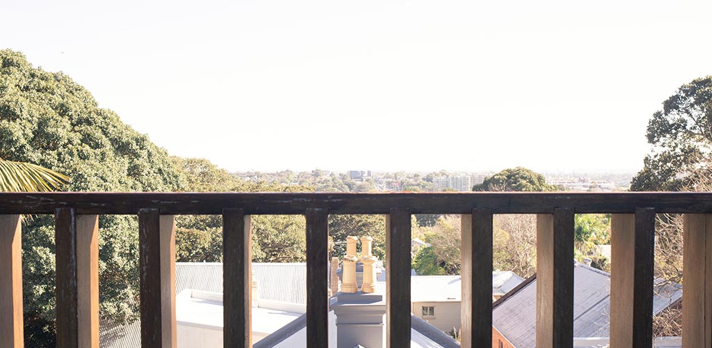 The view from a roof top apartment in Chippendale, A suburb Sydneys Inner West. Taken from the West facing balcony where Aalta Australia had recently installed a retractable awning. The afternoon lights sets over a view of the city.