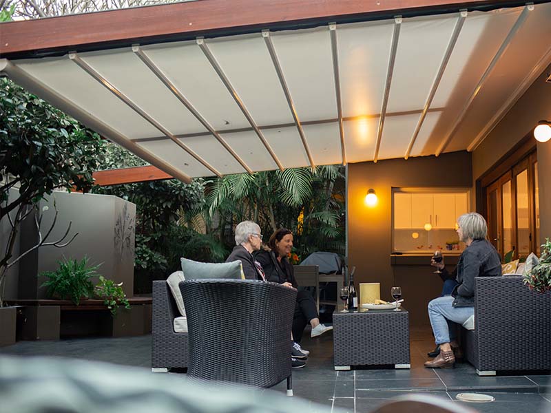 dine outside under a retractable awning in Manly