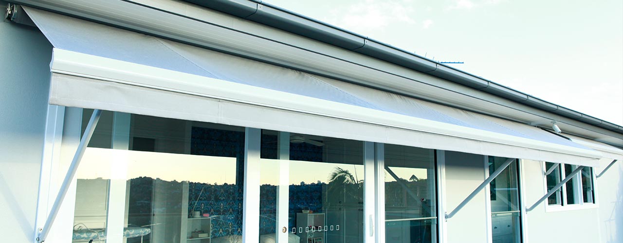 motorised drop arm awning giving relief from the sun and privacy