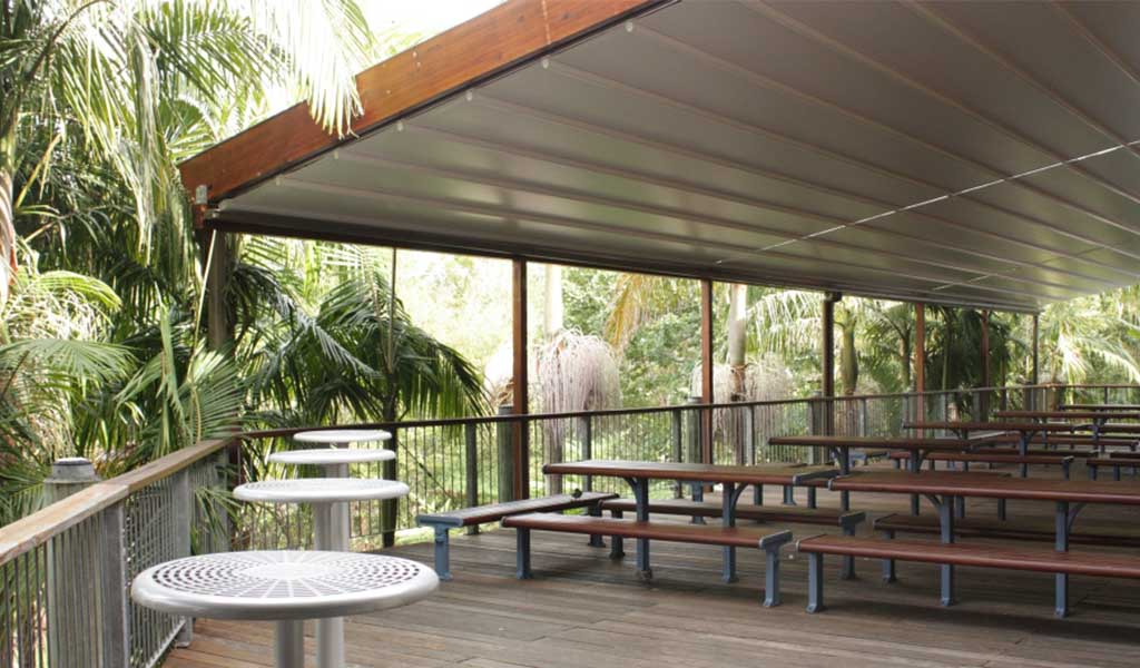 Finished retractable roof over schools courtyard to give shade