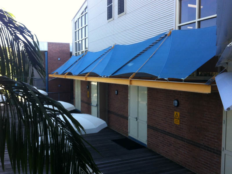 Outside courtyard in school before a retractable roof