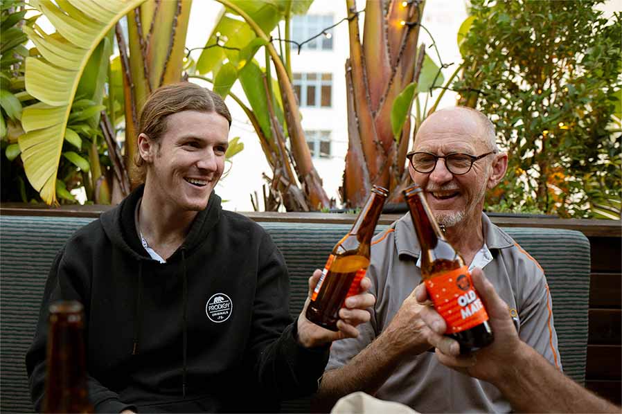 Patrons at Old Mates Place Rooftop Bar enjoying a beer